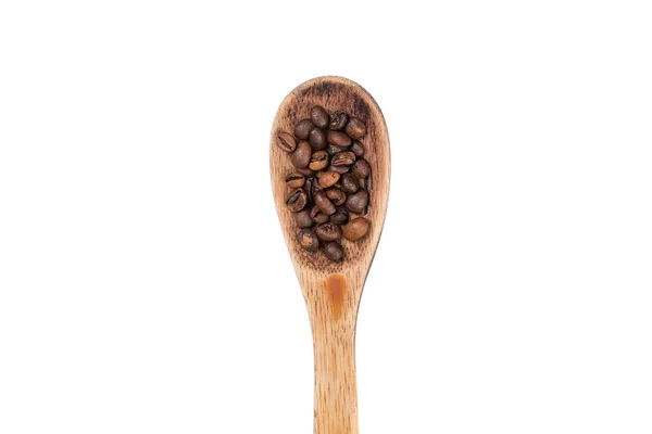 Spread coffee seeds and spoon on a white background — Stock Photo, Image