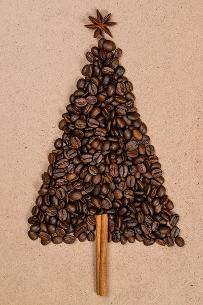 Christmas tree made from coffee beans on wooden background. Top view, copy space.Winter holidays concept. — Stock Photo, Image