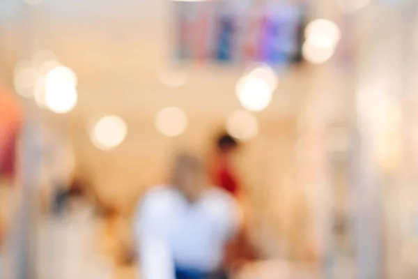 Blurred shopping mall background. Abstract blur background of people lifestyle in store. Modern shopping mall. Store blur background with bokeh.
