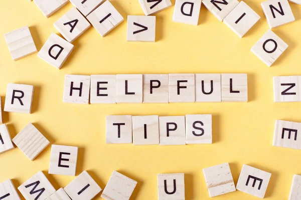 Helpful Tips word written on wood block. Wooden ABC — Stock Photo, Image