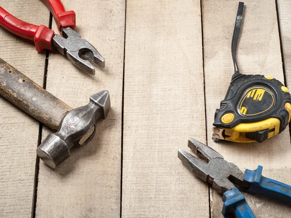 Construction tools on wooden background. Copy space for text. Set of assorted work tool at wood table . Top view — Stock Photo, Image