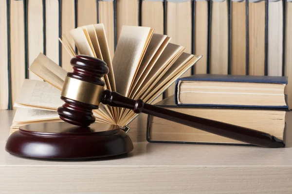 Law concept - Book with wooden judges gavel on table in a courtroom or enforcement office. — Stock Photo, Image