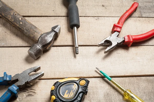 Construction tools on wooden background. Copy space for text. Set of assorted work tool at wood table . Top view — Stock Photo, Image