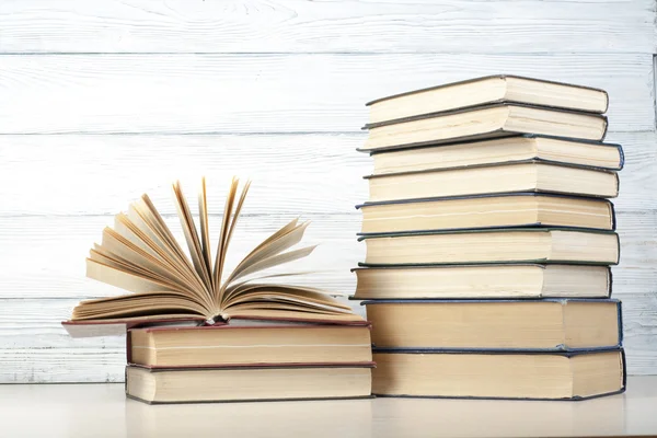 Open book, hardback books on wooden table. Education background. Back to school. Copy space for text. — Stock Photo, Image