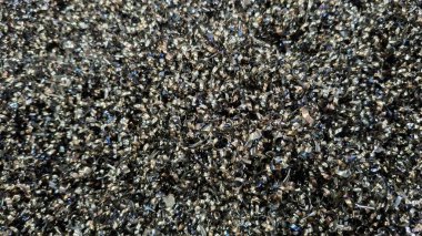 Siyah parıltılı parlak pulların arkaplanı.