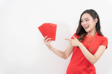 Happy Chinese New Year. Asian woman wearing cheongsam and holding red envelope on white background, symbolizing prosperity and good fortune for Chinese New Year celebration.