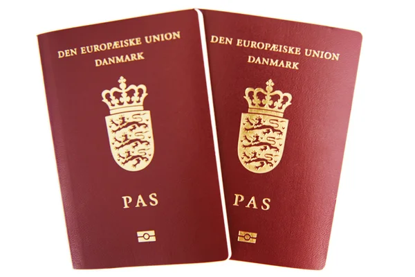 白色背景上的两个丹麦护照 图库图片