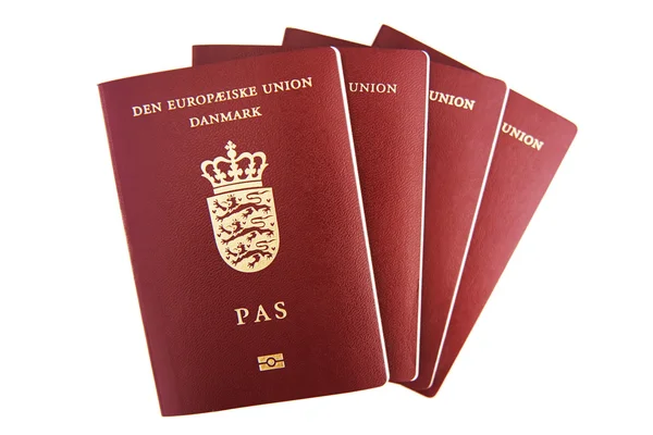 白色背景上的四个丹麦护照 图库图片