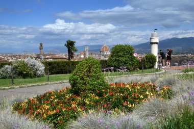 Florence, July 2021: Tourists admire Florence from the gardens of Piazza Michelangelo, Italy.