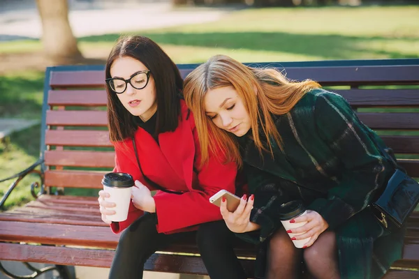 Two girls with gadget — Stock Photo, Image
