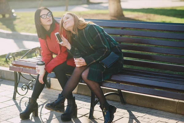 Two girls with gadget — Stock Photo, Image