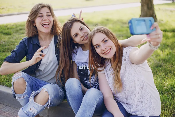 Three beautiful girls on walk — Stock Photo, Image