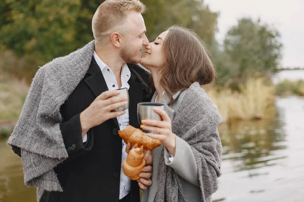 Beautiful couple spend time in by the water