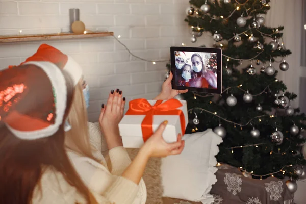 Women having fun with her friends video chat at home for Christmas — Stock Photo, Image