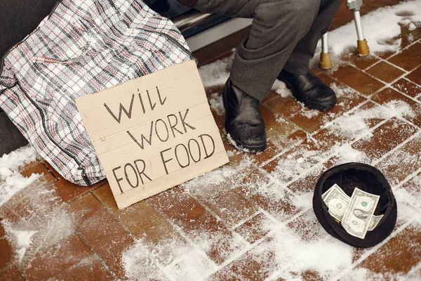 Old homeless man in a durty clothes in winter city — Stock Photo, Image