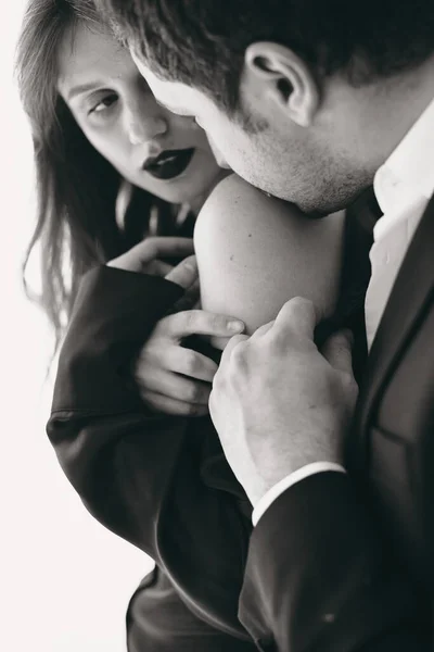 Portrait of young couple in love posing at studio — Stock Photo, Image