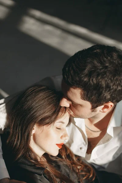 Portrait of young couple in love posing at studio — Stock Photo, Image