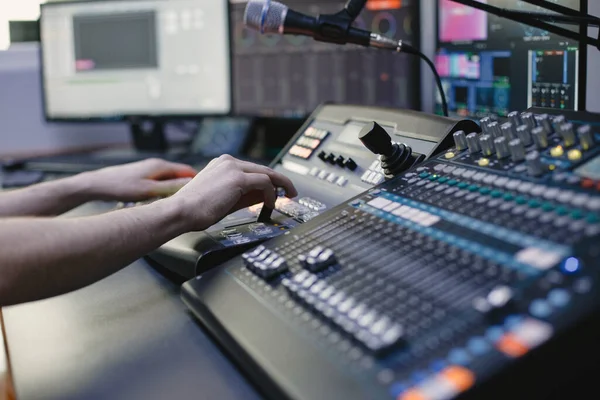 Close up of sound engineer hands recording music — Stock Photo, Image