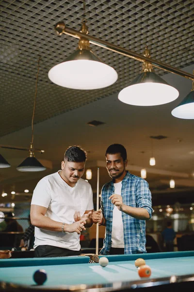 Men playing billiards in a club — Stock Photo, Image