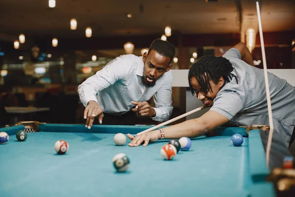 Men playing billiards in a club — Stock Photo, Image