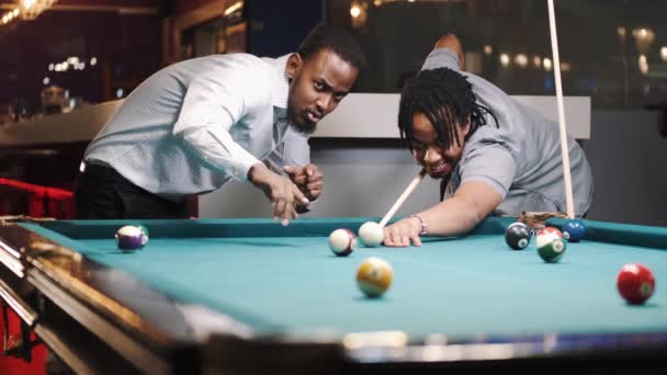 Shot of a young black male in a billiards playroom — Video