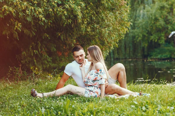 Beautiful couple spend time on a summer field — Stock Photo, Image