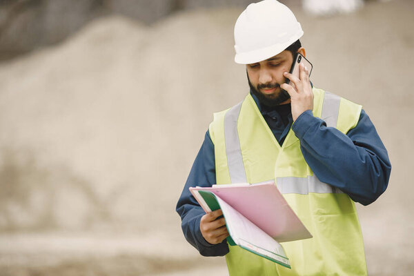 Civil engineer working outside with helmet