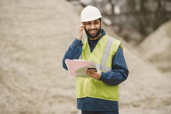 Civil engineer working outside with helmet