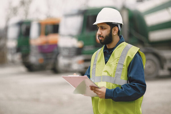 Civil engineer working outside with helmet