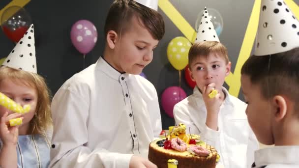 Children celebrating birthday party in a games room — Stock Video