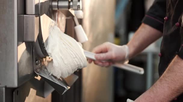 Male confectioner making ice cream at manufacture — Stock Video