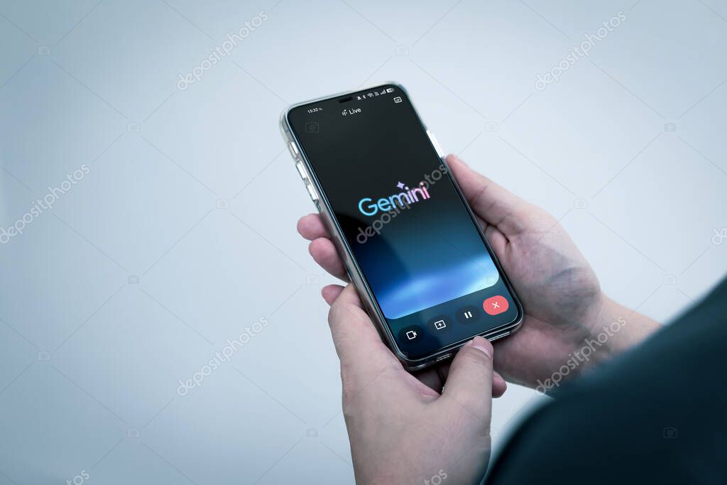 Bangkok, Thailand 1 November 2025. Man use Gemini AI app on smartphone. artificial intelligence (AI) developed by Google, ability to process a wide variety of data.