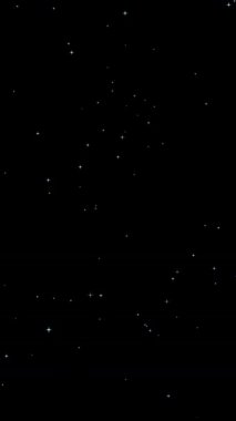 Animation with effects of small shining stars twinkling on black background. 4K vertical