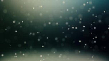 Yüzen organik toz parçacıkları siyah bir arkaplanda parıldıyor..