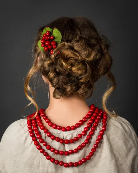 Hair from behind . Pigtails bound behind. Red viburnum in her hair — Stock Photo, Image