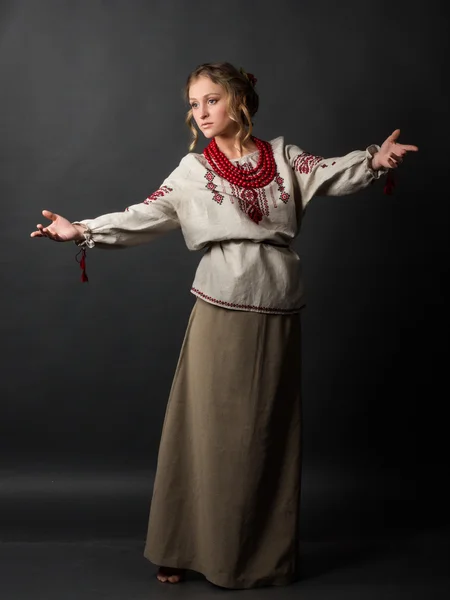 Dancer. Beautiful happy cute young woman in Ukrainian embroidery dancing — Stock Photo, Image
