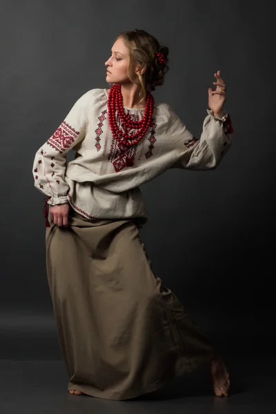 Dancer. Beautiful happy cute young woman in Ukrainian embroidery dancing — Stock Photo, Image