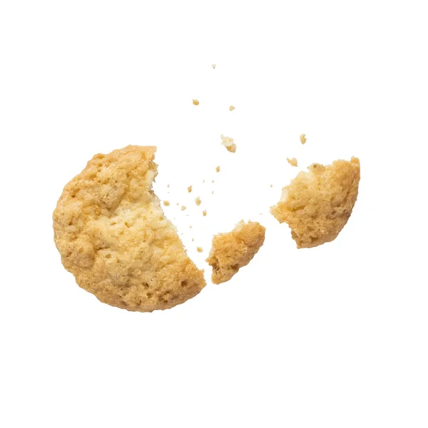 Broken oatmeal cookies with crumbs isolated on a white background — Stock Photo, Image