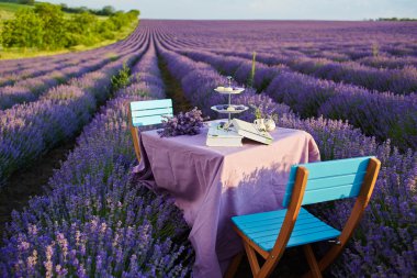 Table decoration in lavender flowers. clipart