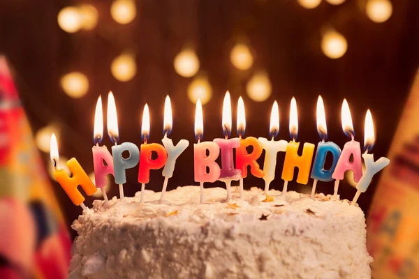 Birthday cake with candles, bright lights bokeh.Celebration. — Stock Photo, Image