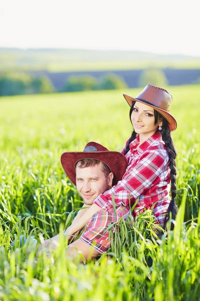 Portrait of happy couple a western style in nature. — Stock Photo, Image