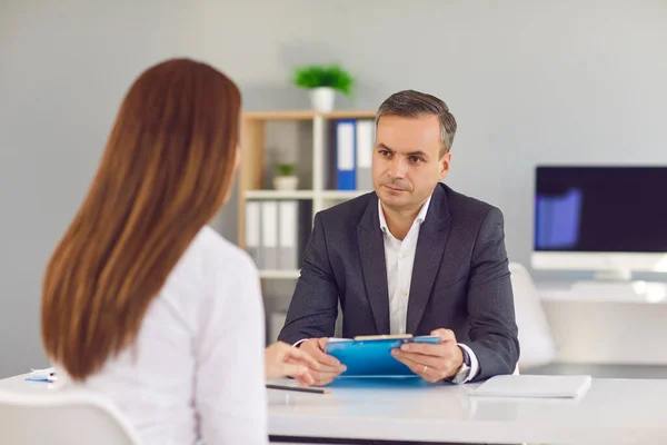 Male HR manager conducts an interview with a female candidate who is getting a job. — Stock Photo, Image