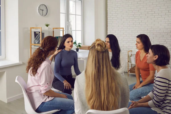 Angry woman sharing her shocking story in therapy session or support group meeting — Stock Photo, Image