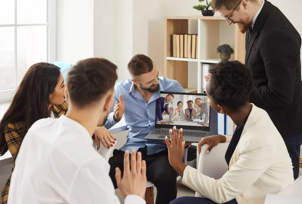 Happy diverse business teams waving hello to each other in online video conference — Stock Photo, Image