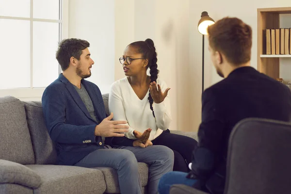 Couple experiencing relationship problem blaming each other during therapy session — Stock Photo, Image