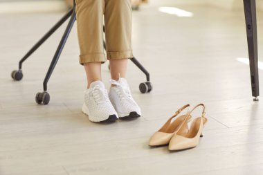 Comfortable sneakers replace high heels, symbolizing balance, wellness and modern lifestyle. Footwear choice shows health awareness and priority of comfort. Comfort in shoes improves daily life.