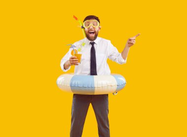 Happy office worker is happy to go on summer annual vacation to sea and advertises resort. Man in suit, with cocktail, snorkeling mask and inflatable ring points finger to side on orange background.