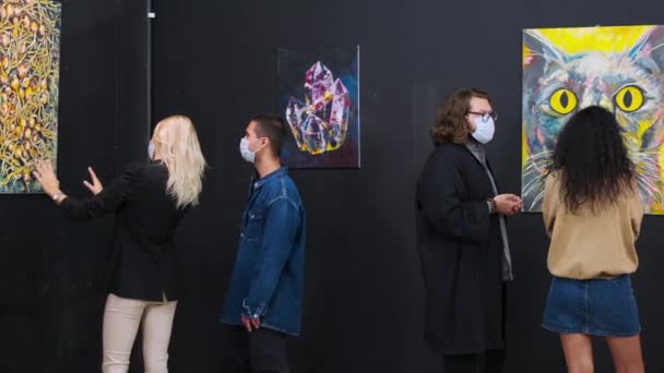 People with face masks for protection from coronavirus in museum — Stock Video