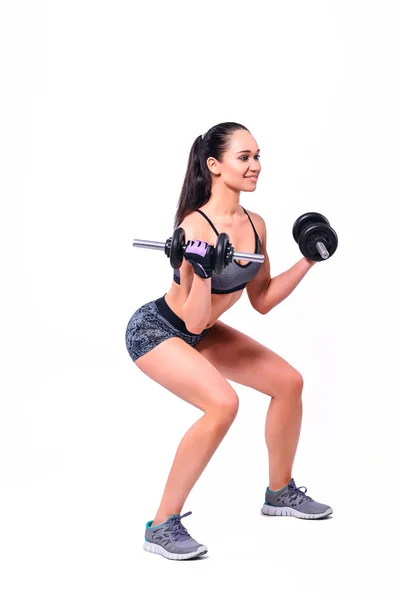 Sports girl with dumbbells doing fitness — Stock Photo, Image