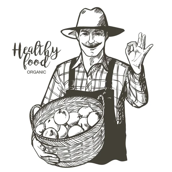 Farmář s kloboukem a knírem s košíkem zeleniny, ovoce, jablek. Člověk s ekologickými plodinami z farmy. Vektorový náčrtek vinobraní — Stockový vektor